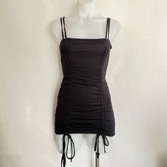 Good Condition. Stitching On Drawstring Loose As Pictured. Solid Color Ruched Mini Dress For Club, Club Mini Dress With Ruched Sides, Black Stretch Ruched Mini Dress, Summer Black Ruched Bodycon Dress, Black Fitted Mini Dress With Drawstring, Chic Bodycon Mini Dress With Drawstring, Fitted Black Mini Dress With Drawstring, Black Bodycon Mini Dress With Ruched Detail, Black Mini Dress With Ruched Sides