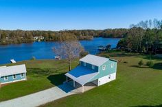 this is an aerial view of the house and lake