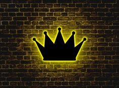 a glowing crown on a brick wall