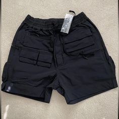 New Whoisjacov Utility Shorts Black Multiple Sizes - Large, Medium. What You See In The Pictures Is What You Get. Ask Any Quiestions Before Buying. Smoke Free Pet Free Home. Black Techwear Shorts For Summer, Black Techwear Shorts With Cargo Pockets, Black Utility Pants For Summer, Black Utility Shorts With Multiple Pockets, Black Techwear Shorts With Side Pockets, Black Cargo Shorts For Streetwear, Black Pants With Multiple Pockets For Summer, Black Shorts With Side Pockets, Black Bottoms With Side Pockets