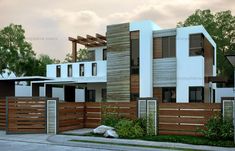 a modern house with wood and white sidings on the front, fenced in area next to it