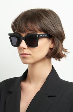 An angular silhouette and scratch-resistant CR-39 lenses enhance the sleek style of these full-coverage sunglasses featuring a logo inlay at the left temple. 52mm lens width; 22mm bridge width; 145mm temple length 100% UV protection CR-39 lenses Acetate Imported Isabel Marant Sunglasses, Modern Sunglasses With Tinted Lenses For Square Face, Modern Black Cat Eye Sunglasses With Anti-reflective Coating, Modern Black Cat Eye Sunglasses With Tinted Lenses, Modern Black Anti-reflective Sunglasses, Modern Black Cat Eye Sunglasses With Uv Protection, Matte Black Cat Eye Shield Sunglasses With Polarized Lenses, Modern Black Square Frame Sunglasses, Modern Matte Black Cat Eye Sunglasses