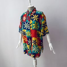 Vintage - Women's Relaxed Fit Colorful Floral Pattern Short Sleeve Festival Shirt Blouse Label size 46, fit size XL Flat measurements: armpit to armpit: 23.5" (60 cm), length: 29.5" (75 cm) Mint condition Vibrant Multicolor Printed Shirt, Retro Summer Blouse With Colorful Pattern, Retro Colorful Pattern Blouse For Summer, Retro Blouse With Colorful Pattern For Summer, Retro Multicolor Blouse For Vacation, Retro Colorful Summer Blouse, Beach Patchwork Tops With Short Sleeves, Beach Tops With Patchwork And Short Sleeves, Patchwork Short Sleeve Tops For Beach