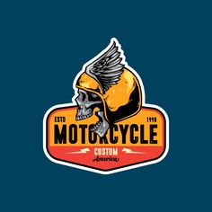 a motorcycle emblem with a skull on the front and wings in the back, against a dark blue background