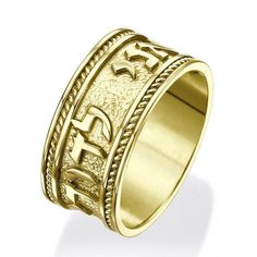 a gold ring with the word jesus engraved on it