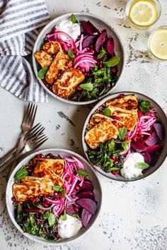 three bowls filled with chicken, beets and onions