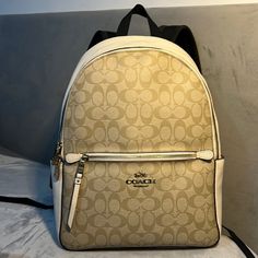 Sold Out Coach Back Pack In Signature Canvas Classic Beige Backpack With Zipper Closure, Luxury Beige Everyday Backpack, Classic Beige Backpack For On-the-go, Leather Backpack With Zipper Closure In Cream, Cream Leather Backpack With Zipper Closure, Luxury Beige Backpack Bag, Designer Beige Bags With Zipper Closure, Classic Softback Bag, On-the-go Coated Canvas Backpack