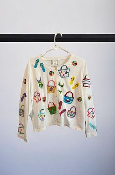 Vintage Michael Simon Long Sleeve Button Down Beach Novelty Print Shirt Size Tag Cut Out But Large Based On Measurements! Beachy Whimsical Print With Flip Flops, Beach Ball, Tote Bags, Etc Embroidered Button Down 100% Cotton Measures 22” Pit To Pit 21” Length Excellent Vintage Condition. Feels Unworn, No Flaws. White Buttoned Top For Vacation, Spring Vacation Tops With Buttons, Summer Tops With Button Closure For Beach Season, Cotton Tops With Buttons For Beach Season, Beachy Long Sleeve Tops For Spring, Summer Beach Tops With Buttons, Spring Long Sleeve Beachy Tops, Summer Vacation Tops With Buttons, Summer Tops With Buttons For Vacation