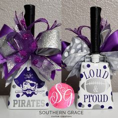 two bottles with purple and silver decorations on them