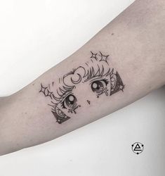 a woman's arm with an eye and stars tattoo design on the left forearm