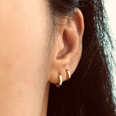 These simple, minimalist solid round hoop earrings are made of solid 925 sterling silver, highly polished for a great shine with a 18k gold plate to create luxury look.The hoop earrings ear huggies come in different inner diameter: 6 mm, 7 mm, 8 mm, 9 mm that can be fit on different position such as 2nd and 3nd ear lobs or tragus, cartilages. Hoop design make them comfortable to wear everyday even at night. Jewelry Care: See more information about how to care for your jewelry here. Shipping Policy: Orders will be shipped within 1-3 business days. Economy shipping will take 7-14 days to arrive and standard shipping is 1- 4 days for U.S. orders. International shipping time is depended on the country and per shipping method. Shipping cost will be calculated at check out.For more details, see Minimalist 14k Gold Hoop Earrings With Shiny Finish, Minimalist Huggie Earrings With Polished Finish, Simple 14k Gold Tarnish-resistant Huggie Earrings, Simple 14k Gold Tarnish Resistant Huggie Earrings, Minimalist Gold Plated Hoop Earrings With Shiny Finish, Minimalist Sterling Silver Tarnish-resistant Hoop Earrings, Minimalist 14k Gold Huggie Earrings With Shiny Finish, Gold Plated Minimalist Round Cartilage Earrings, Minimalist Polished Finish Huggie Earrings