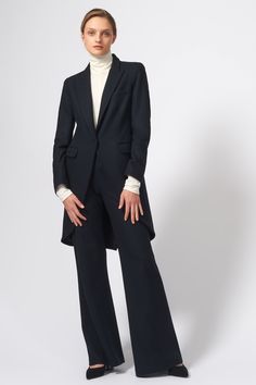 Our signature Tailored Tux Blazer is a favorite among Kal Rieman fans. Made from our timeless Japanese boiled wool, this style has a long tail back hem for the perfect dandy look. Style features long back vent, flap pockets, genuine horn buttons, our signature stripe sleeve lining.... roll up your sleeves to show your style. Front cut away front, single button closure, chest pocket and front flap pockets, tail back shape with long back single vent, working cuff buttons, signature stripe sleeve l Luxury Tailored Single-breasted Blazer, Tailored Single-breasted Collared Blazer, Luxury Tailored Long-sleeve Blazer, Classic Long-sleeved Blazer With Welt Pockets, Avant-garde Tailored Long Sleeve Blazer, Dandy Look, Belted Cardigan, Car Coat, Boiled Wool