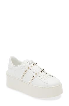 Signature pyramid studs shine across the leather upper of this Italian-crafted platform sneaker refined with an innovative lacing technique. 2" heel (51mm); 1 1/2" platform (size 38.5) Lace-up style Leather upper and lining/synthetic sole Made in Italy Designer Shoes Luxury Studded Platform Sneakers With White Sole, Luxury Low-top Platform Sneakers With Studded Outsoles, Luxury Leather Platform Sneakers With Studded Outsoles, Luxury Studded Lace-up Sneakers, Designer Studded Low-top Sneakers, Luxury White Studded Sneakers, Designer Low-top Platform Sneakers, Low-top Leather Sneakers With Studs, Luxury White Sneakers With Spikes