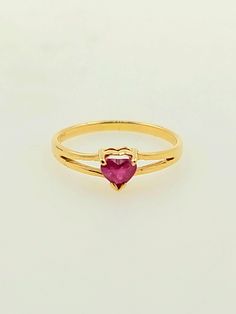 Beautifully vintage 1990s handcrafted 14K yellow gold ring. There is a natural ruby placed in the center of this ring which is heart shaped. Split Shank ring This gorgeous ring is a great gift idea for Valentine's Day, anniversary or a birthday celebration.  Ring size: 1 1/2 (sizeable upon request) Total ruby weight approx: 0.10 ct Total ring weight: 0.7g Hallmarks: 14K HABCO Will be placed into a suitable gift box Free shipping within the U.S. Gold Heart Cut Ruby Birthstone Ring, Gold Ruby Heart Cut Ring For Promise, Gold Ruby Heart Cut Promise Ring, Formal Gold Ruby Ring With Heart Cut, Ruby Heart Gold Ring, Heart Cut Ruby Ring In Yellow Gold For Promise, Classic Heart Cut Ruby Ring In 14k Gold, Heart Cut Yellow Gold Ruby Promise Ring, Classic 14k Gold Heart Cut Ruby Ring