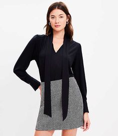 In a soft jersey knit, our modern bow blouse is softly shirred and cinched with a tie neck for an irresistibly feminine twist. V-neck with ties. Long sleeves with pleated button cuffs. Back yoke. Shirttail hem.,Bullet1:25 1/2" long,Imported:Imported,Fit:Fit: Classic — follows your contours with a little room,Length:Length: Regular - hits below natural waist,Fabrication:92% Lyocell 8% Spandex,Garment Care:Machine Washable Loft Jersey Bow Blouse Size XS Black Women's by Loft Size Regular - XS Blac Workwear V-neck Blouse With Tie Sleeves, V-neck Blouse With Tie Sleeves For Work, Chic Viscose Tie Neck Top, V-neck Top With Tie Sleeves For Work, Workwear V-neck Top With Tie Sleeves, V-neck Workwear Top With Tie Sleeves, Tie Neck Viscose Tops For Workwear, Viscose Tie Neck Top For Work, V-neck Top With Tie Waist For Work