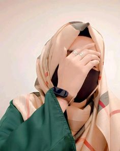 a woman wearing a scarf covering her face