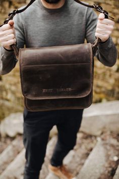 If you think it is time to ditch your old, tired-looking messenger bag, then check out our newest addition to the ever-popular shoulder carryall. No polyester material or plastic buckle in sight, this handcrafted messenger bag shows off high quality saddle leather and antique-coloured hardware. Long-term use will produce a deeper tone in the leather, adding character to it and enhancing the bag’s overall appearance. Based on the traditional school satchel design, the bag has a large flap closure Rectangular Satchel With Waxed Finish For Outdoor, Rectangular Leather Satchel For Outdoor, Classic Crossbody Shoulder Bag For Outdoor, Classic Outdoor Crossbody Shoulder Bag, Outdoor Rectangular Satchel With Adjustable Strap, Classic Rectangular Briefcase For Outdoor, Rectangular Waxed Finish Satchel For Outdoor, Outdoor Rectangular Leather Satchel, Outdoor Rectangular Leather Bag