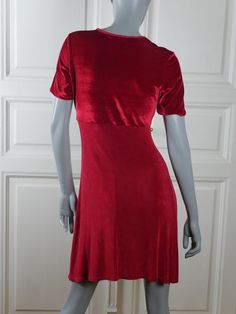 This Danish vintage red dress has a round neckline, short sleeves, and an empire waistline that gives way to an A-line above-the-knee skirt. The slip-on dress has a red velvet bodice and sleeves and a red lycra skirt. Brand label: Jacqueline De Young Collection Size: 6 US, 10 UK (see exact measurements below) Material: Polyester, Lycra Condition: Excellent ---MEASUREMENTS--- Bust = 34 inches (86cm) Waist = 27 inches (68.5cm) Hips = 37 inches (94cm) Sleeve Length = 9 inches (23cm) Dress Length = Solid Crew Neck Party Dress, Red Fitted Mini Dress With Short Sleeves, Fitted Red Mini Dress With Short Sleeves, Red Short Sleeve Midi Dress For Evening, Red Short Sleeve Evening Dress, Vintage Red Short Sleeve Dress, Red Fitted Dress With Short Sleeves, Red Short Sleeve Mini Dress For Formal Occasions, Red Mini Dress With Short Sleeves For Evening