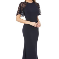 Sequined Lace Sleeves And A Plunging V-Back To This Crepe Trumpet Gown, Spicing The Structured Look With Softness And Shimmer. Get The Perfect Fit--Book An Appointment With One Of Our Alterations Experts. Back Zip Closure - Jewel Neck - Short Sleeves - Lined- Dry Clean - Imported - Special Occasion Materials Body: 98% Polyester/2% Spandex; Combo: 100% Nylon; Lining: 100% Polyester Fit True To Size. Us Size; 10 Bust: 36.5” Waist: 28.5” Hips: 39” Length 64” (All Measurements Are Fitted Evening Dress With Lace Sleeves For Gala, Fitted Gala Evening Dress With Lace Sleeves, Fitted Lace Sleeve Evening Dress For Gala, Fitted Mother Of The Bride Dress With Sheer Sleeves, Formal Fitted Gown With Lace Sleeves, Fitted Gown With Lace Sleeves Maxi Length, Fitted Maxi Gown With Lace Sleeves, Fitted Maxi Dress With Lace Sleeves For Gala, Fitted Maxi Dress With Lace Short Sleeves