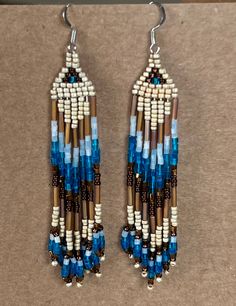 Unique one of a kind hand beaded by a Native American artist. These and all of the jewelry have been designed and made by me. Artisan Beaded Earrings With Fringe, Artisan Beaded Fringe Earrings For Jewelry Making, Artisan Brown Beaded Fringe Earrings, Artisan Jewelry With Beaded Fringe For Crafting, Artisan Hand-strung Beaded Dangle Earrings, Artisan Hand-strung Beaded Earrings, Artisan Jewelry With Beaded Fringe, Traditional Brown Beaded Fringe Earrings, Artisan Beaded Fringe Dangle Earrings