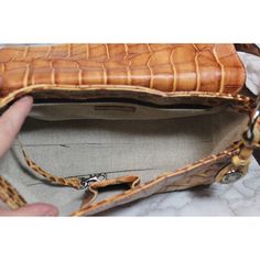 This classic Dooney & Bourke shoulder bag measures approximately 6” x 12” x 4”. This is a used bag with minimal wear. Please closely inspect all photos before purchasing. Closure: Snap Strap Drop: 9” Color: Brown Pockets: 2 Interior & 2 Exterior Material: Leather Style: Shoulder Bag Photos are Actual pictures, not stock photos. Authenticity Note: We have been trained to spot fake designer bags, and closely inspect each purse to verify authenticity. If we have any doubts, we NEVER sell it. That s Vintage Leather Baguette Shoulder Bag, Vintage Leather Baguette Bag With Detachable Strap, Vintage Leather Baguette Bag For Everyday Use, Formal Brown Shoulder Bag With Cell Phone Pocket, Formal Rectangular Satchel With Cell Phone Pocket, Rectangular Baguette Bag With Leather Lining For Daily Use, Rectangular Baguette Bag For Daily Use, Vintage Rectangular Satchel With Cell Phone Pocket, Formal Satchel Shoulder Bag With Cell Phone Pocket