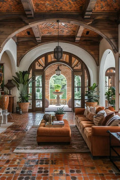 a living room filled with lots of furniture and decor on top of tiled flooring