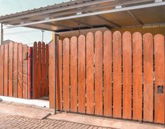 a wooden fence is next to a building