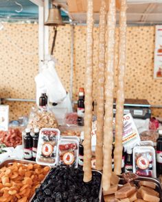 an assortment of snacks are on display in a buffet table at a party or gathering