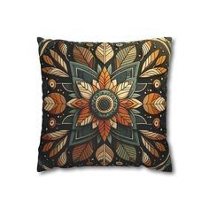 a decorative pillow with an intricate design on the front and back, featuring leaves in various colors