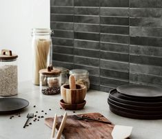 the kitchen counter is clean and ready to be used for cooking or baking with utensils on it