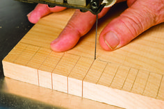 a person using a drill to cut wood