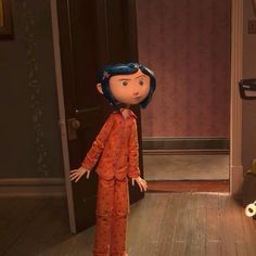 an animated doll standing in front of a door