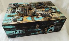 an old box is decorated with various metal parts and numbers on the inside, including keys