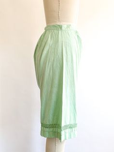 Feminine cotton summer shorts. Layer under a dress or wear with a cute crop or tank top. Easy and wearable, hand dyed a minty green shade. Fabric: CottonFit: XSEra: 1920's Measurements:Waist 25"Hips 59"Rise 16"Inseam 12"Length 20.5"Leg opening 11.5" Condition: Great. Dye imperfections may be present with hand dyed items. Old cottons can have signs of wear or minuscule holes. See all images. Bohemian Bottoms For Spring Daywear, Green Wide Leg Bottoms For Daywear, Green Cotton Bottoms For Daywear, Green Relaxed Fit Wide Leg Shorts, Green Linen Beach Bottoms, Green Daywear Shorts For Spring, Green Shorts For Spring Daywear, Green Shorts For Daywear In Spring, Green Wide Leg Pants For Daywear