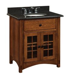 a wooden sink cabinet with black marble top