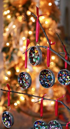 a christmas tree with ornaments hanging from it's branches