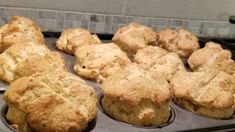 freshly baked muffins sitting in a pan ready to be eaten