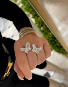 Diamond butterfly ring in white gold. Sold by RingWraps.com Luxury Butterfly Ring With Brilliant Cut For Wedding, Luxury Butterfly Ring With Cubic Zirconia, Luxury Cubic Zirconia Butterfly Ring, Luxury White Gold Butterfly Ring With Cubic Zirconia, Brilliant Cut Cubic Zirconia Butterfly Ring As Gift, Luxury Cubic Zirconia Diamond Ring For Evening, Luxury Diamond Butterfly Ring For Formal Occasions, Luxury Butterfly Ring For Anniversary, Luxury Evening Rings With Baguette Diamonds