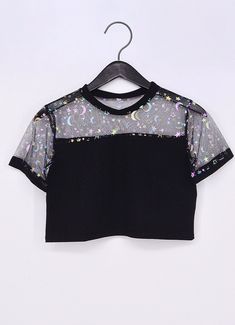 Step into the night with our Plus Size Mystic Nightfall Crop Top. Combining the allure of iridescent cosmic print mesh with the comfort of stretchy black cotton, this crop top is perfect for making a bold fashion statement. Available in sizes 1X to 4X, it’s designed to flatter and fit curvy figures, offering both style and comfort for any occasion. Iridescent Cosmic Print:🌛 The top features a mesmerizing iridescent cosmic print on the mesh fabric, showcasing stars, moons, and constellations tha Alt Fashion, Jeans Material, Alternative Outfits, Pastel Goth, Goth Fashion, Black Crop Tops, Alternative Fashion, Aesthetic Clothes, Work Outfit