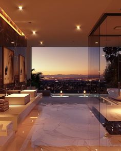 a large bathroom with two sinks and a bathtub next to a window overlooking the city