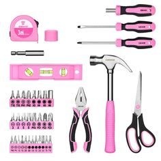 the tools are pink and black with white trimmings on them, including pliers, wrenches, screwdrivers, and more