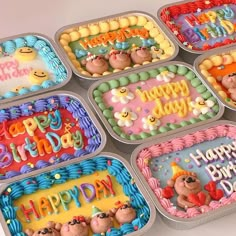 there are six birthday cakes in the trays