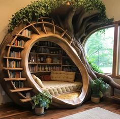 a room with bookshelves in the shape of a tree, and a couch