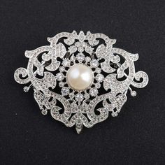 *Victorian American Diamond & Fresh Natural Pearl Handmade Brooch, 925 Sterling Silver Purity Brooch, Wedding/Engagement Brooch **Product Details :-- *Gemstone :-- American Diamond (CZ) & Fresh Pearl *Gemstone Weight :-- 6.80ct Zircon & 4.25ct Pearl *Metal -- 925 Sterling Silver *Silver Wt. -- 25-30gm *Finishing : Platinum Plated Over 925 Silver *This is very Beautiful & Pretty Brooch. Everyone Can be gifted it For His/Her Mother and Daughter. ▶ Want to find out more? Check out my shop https://w Luxury Silver Engagement Brooches, Wedding Sterling Silver Brooch With Intricate Design, Victorian Silver Wedding Brooches, Victorian Silver Brooches For Gifts, Victorian Hallmarked Diamond Brooches, Brooch Wedding, Antique Brooches, Brown Diamond, Natural Pearl