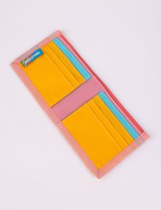 This rad wallet is the perfect place to keep all of your money related objects! Features 6 front-facing credit card slots with 2 extra hidden slots, a main cash pocket, color block detailing, and nylon binding. Shop all WalletsShop all Daydream Measures 9" wide x 4" tall unfolded, 4.5" wide folded.Water resistant 100% Coated Nylon Made in Los Angeles, California Everyday Multicolor Bifold Wallet, Bifold Multicolor Card Holder For Daily Use, Retro Pink Wallet For Everyday Use, Multicolor Bifold Card Holder, Multicolor Bifold Wallet For Everyday Use, Multicolor Bifold Wallet For Travel, Multicolor Bifold Wallets For Travel, Multicolor Rfid Blocking Wallets For Daily Use, Multicolor Rfid-blocking Card Holder For Travel