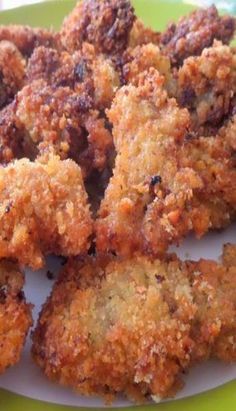 some fried food on a green and white plate