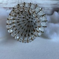 a close up of a ring made out of glass beads