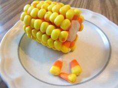 a plate with candy corn on it that says sweet happy halloween