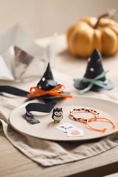 a white plate topped with halloween decorations on top of a table