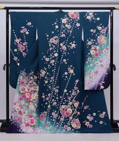 Cover yourself in a garden of flowers wearing this traditional Japanese silk Furisode kimono in teal green.   Made of high quality silk threads.  Beautiful to wear or as a room display. Item: Furisode Silk Kimono No. frn023 Size: US  XL   /  Length  68.8 inch (175cm), Width 28 inch (71.5cm) Design :  Floral Condition: Used, Very Good. Please check the photos. Need a KIMONO RACK to hang this kimono?  Find it here: https://www.etsy.com/listing/1303669853/kimono-rack-japanese-kimono-display-rack Sh Traditional Wedding Kimono With Floral Embroidery, Multicolor Spring Wedding Kimono, Traditional Spring Wedding Kimono, Traditional Floral Print Kimono For Tea Ceremony, Blue Floral Print Kimono, Silk Kimono With Floral Embroidery, Elegant Long-sleeved Kimono With Floral Embroidery, Furisode Kimono, Blue Printed Silk Kimono